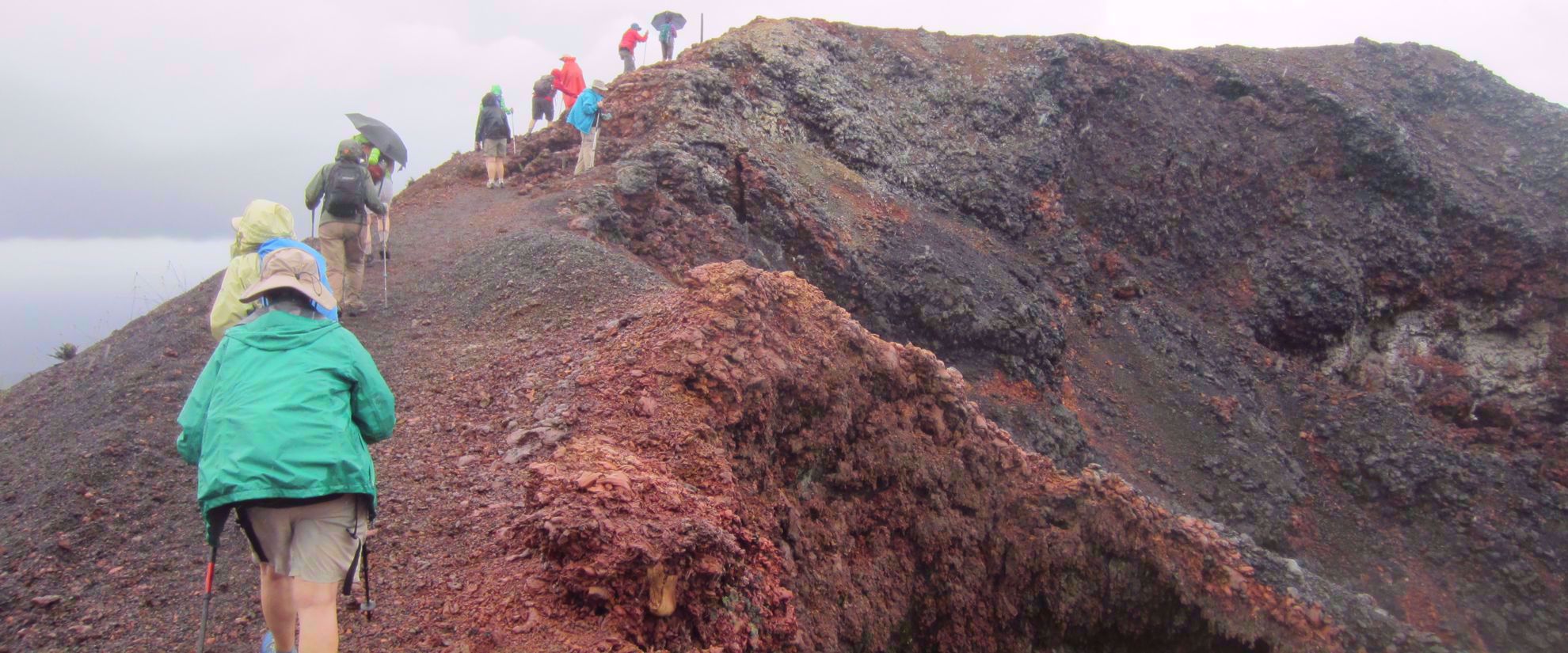 women hiking up volcano in galapagos