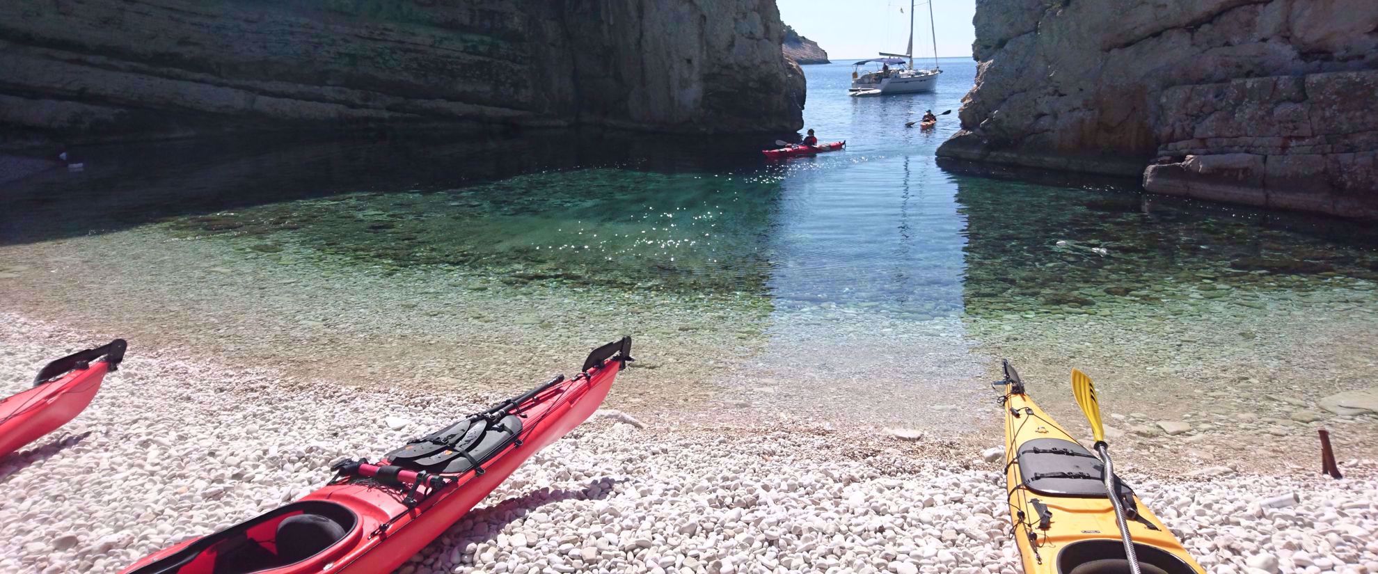 kayaks on beach crystal clear water croatia