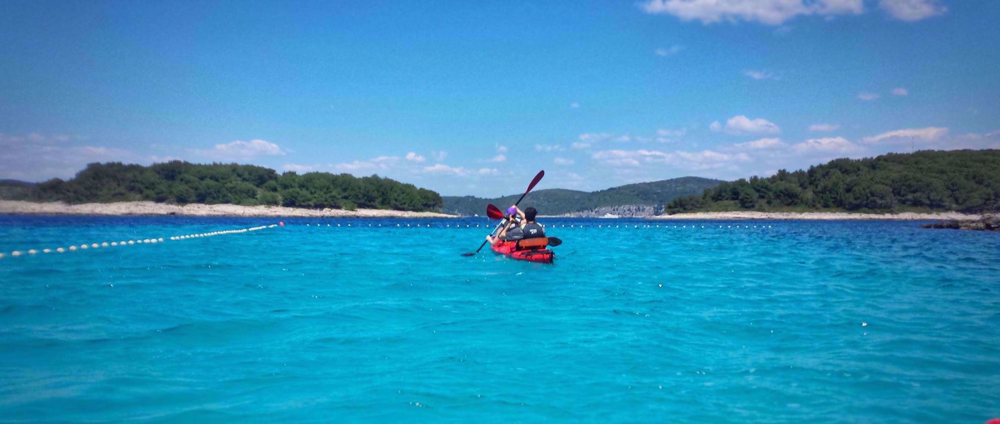 stunning blue water with orange kayak croatia