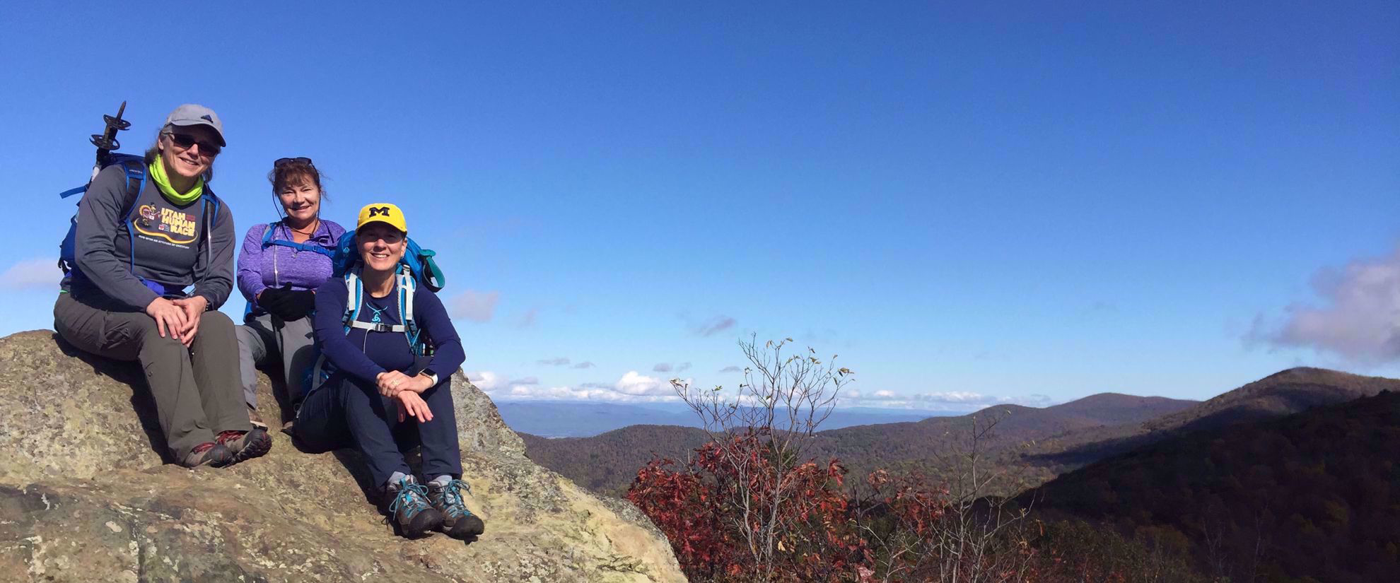 women on adventure tour smile for photo appalachian trail