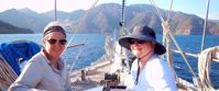 women boating through mediterranean