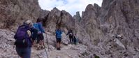 women's hike through rocky italian alps