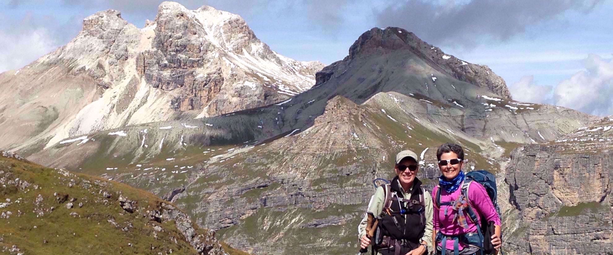 women smile on group trek through northern italian alps