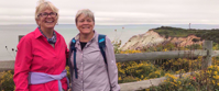 Women smiling on group trip to Cape Cod