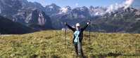 victorious woman hiking through swiss alps