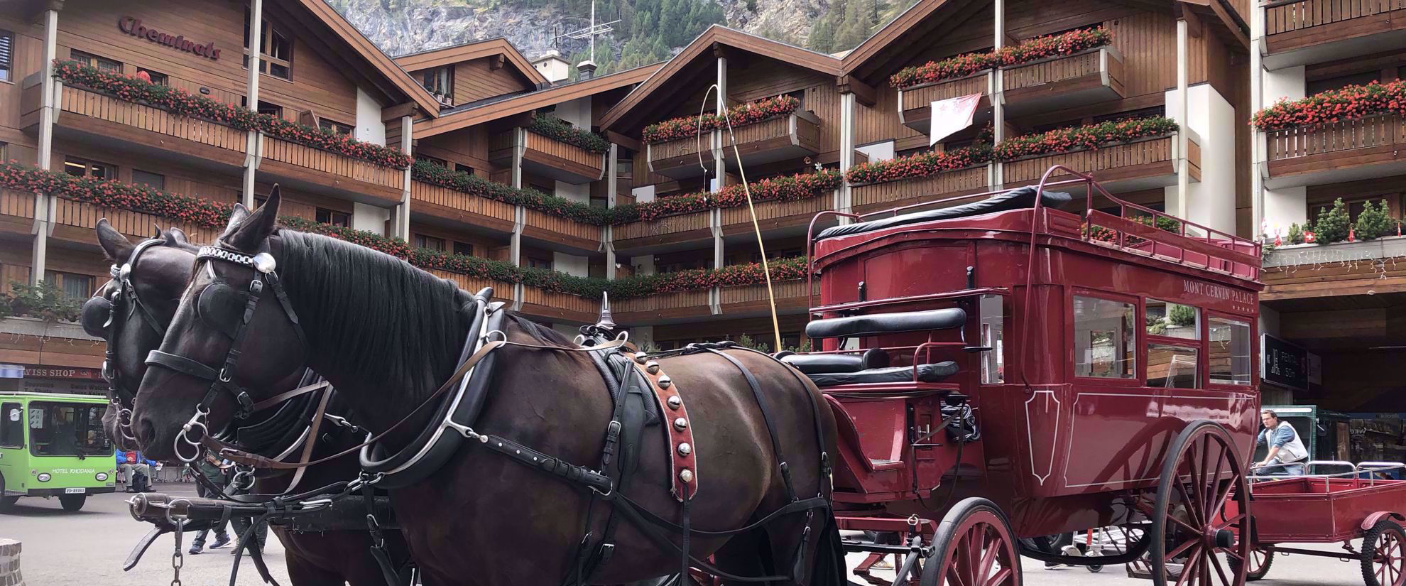 horse drawn carriage at lodge in swiss alps