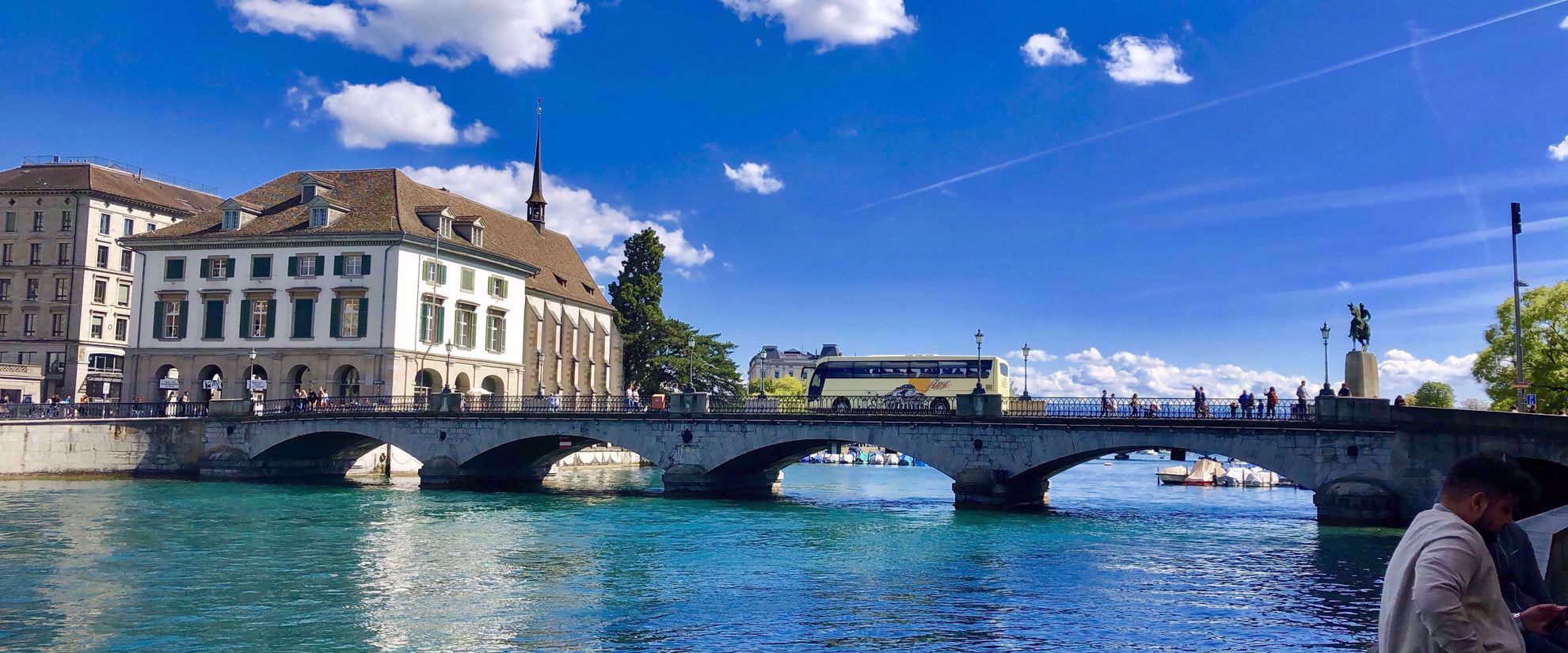 beautiful bridge and blue water canal in swiss alps