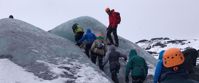 women hiking on glacier iceland