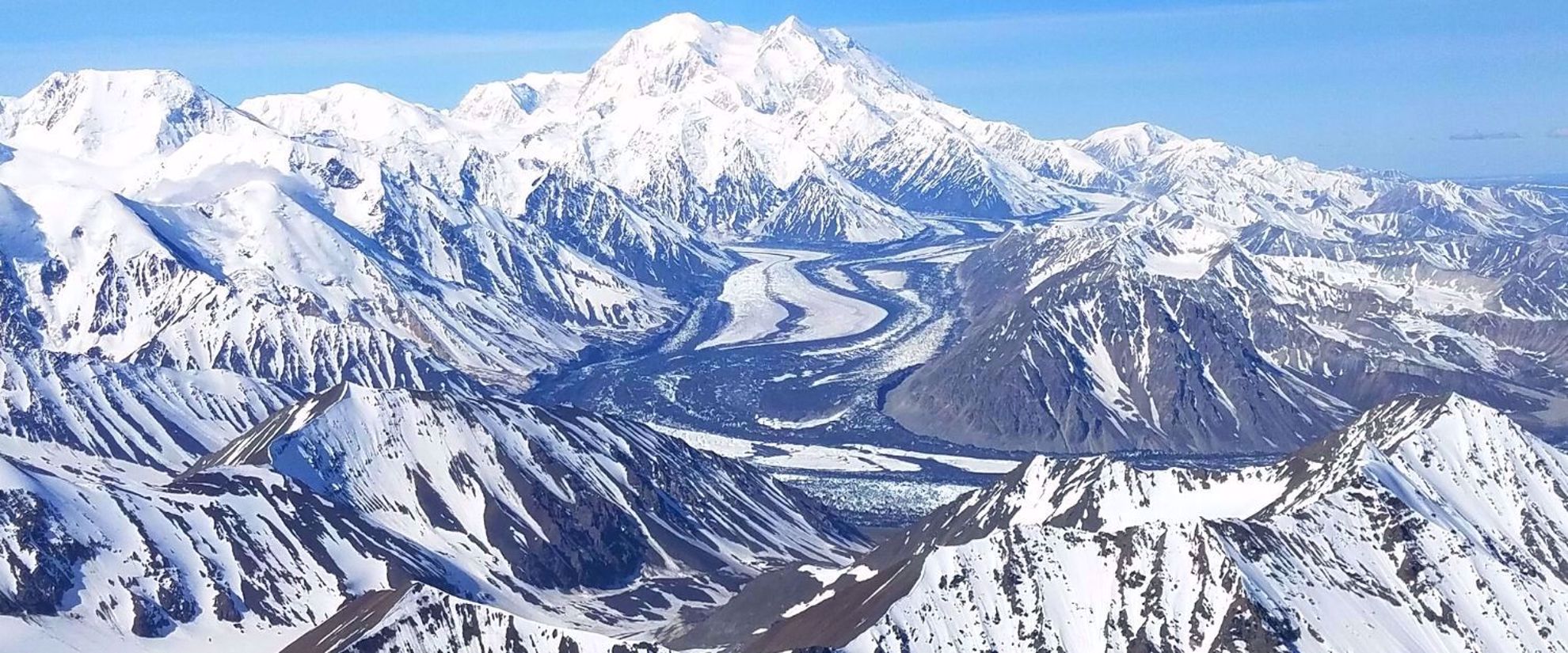 Snowy Alaskan mountain range from the air 